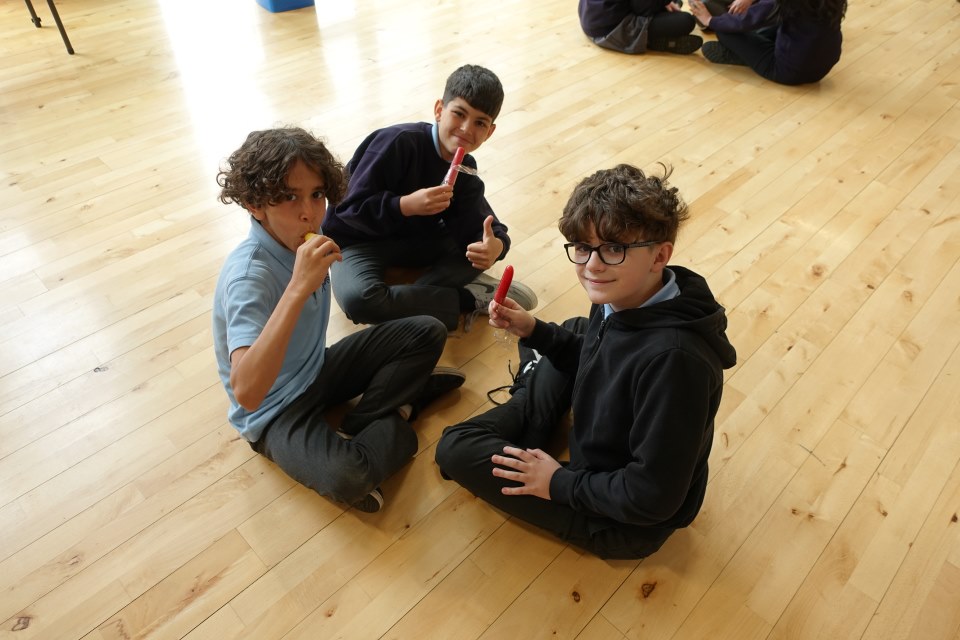 A group of Year 6 children enjoying some lolly pops after finishing SATs