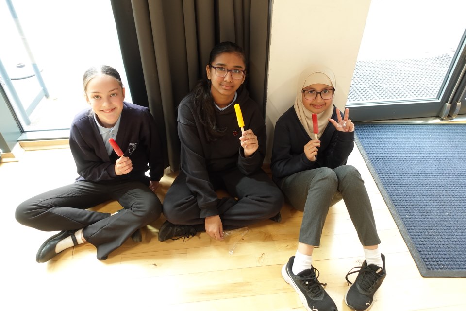 A group of Year 6 children enjoying some lolly pops after finishing SATs