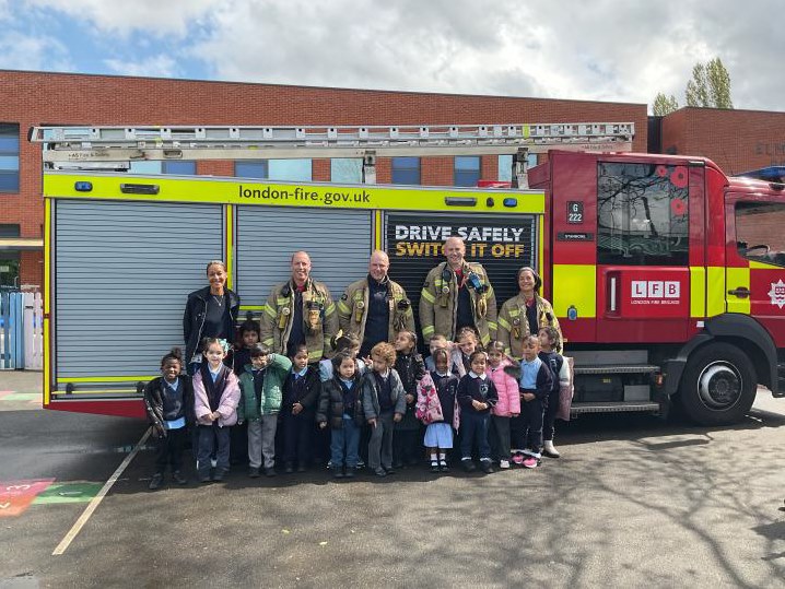 Group photo of nursery and the fire brigade 