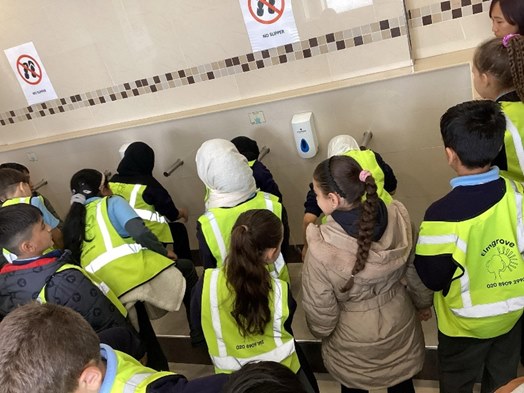 Year 4 washing hands and feet at the mosque