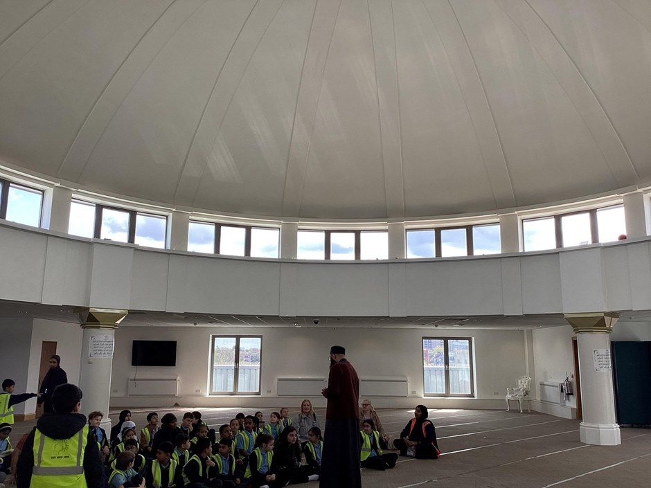 Year 4 getting a talk from a member of the mosque