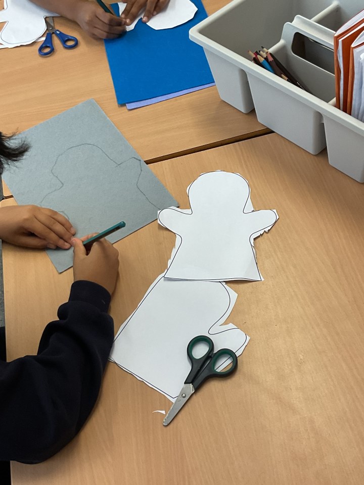 Child drawing a hand puppet