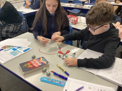 Year 6 children working on circuits