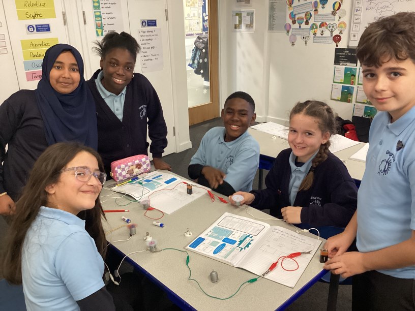 Year 6 children working on circuits