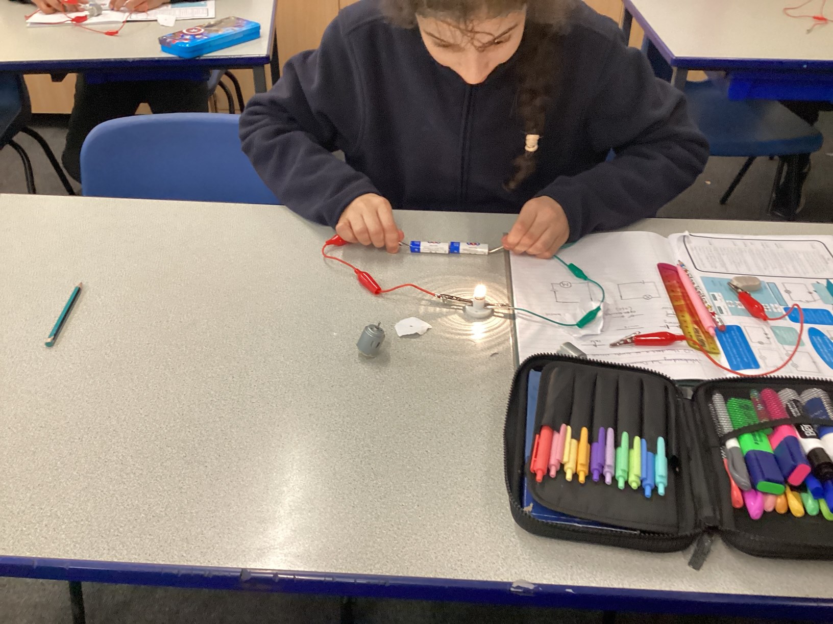 Year 6 children working on circuits