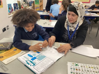 Year 6 children working on circuits