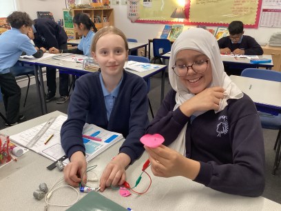 Year 6 children working on circuits