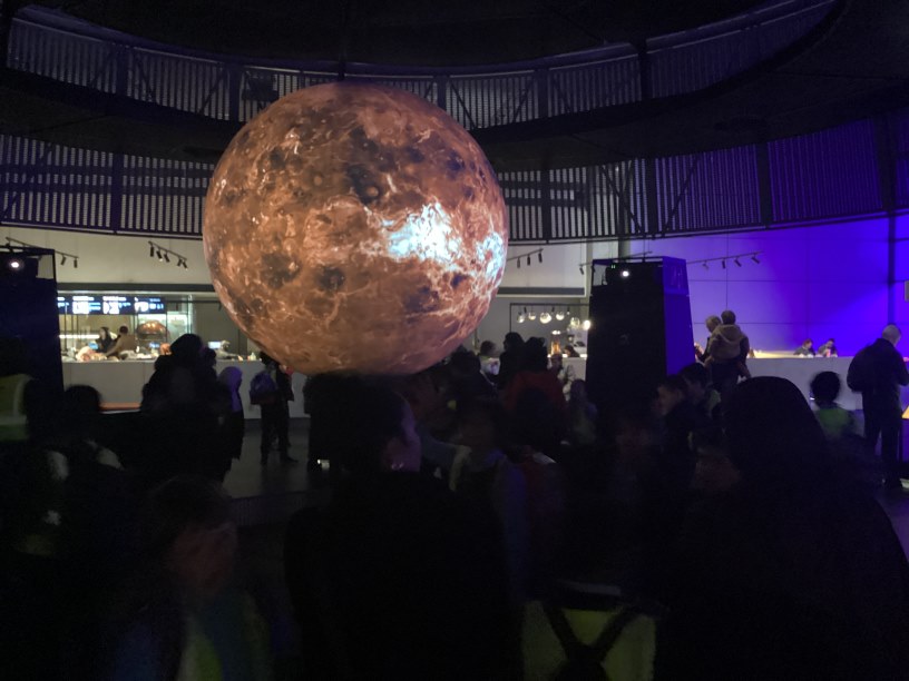 Some year 5 children around a giant Mars map